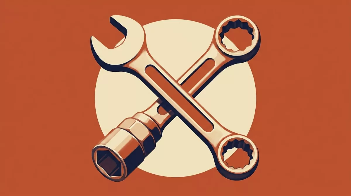 A mechanic working in an auto repair shop bay with tools laid out on a workbench