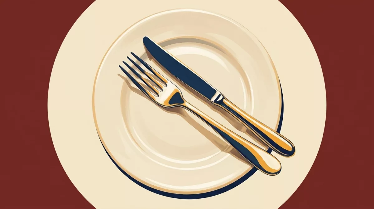 A restaurant table set for service with a phone displaying an online ordering screen beside it